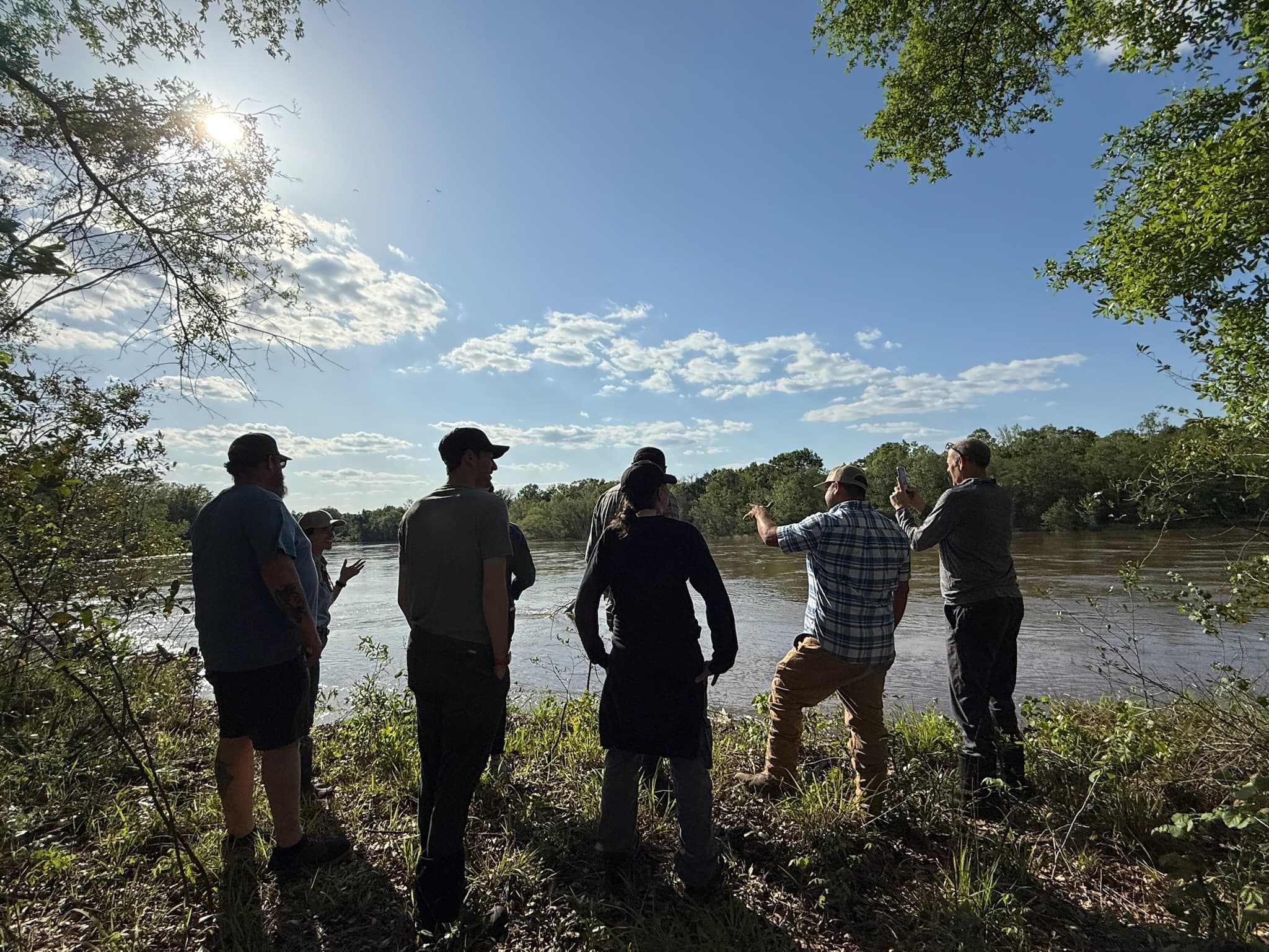 A group taking in the river view at River Woods Ranch
