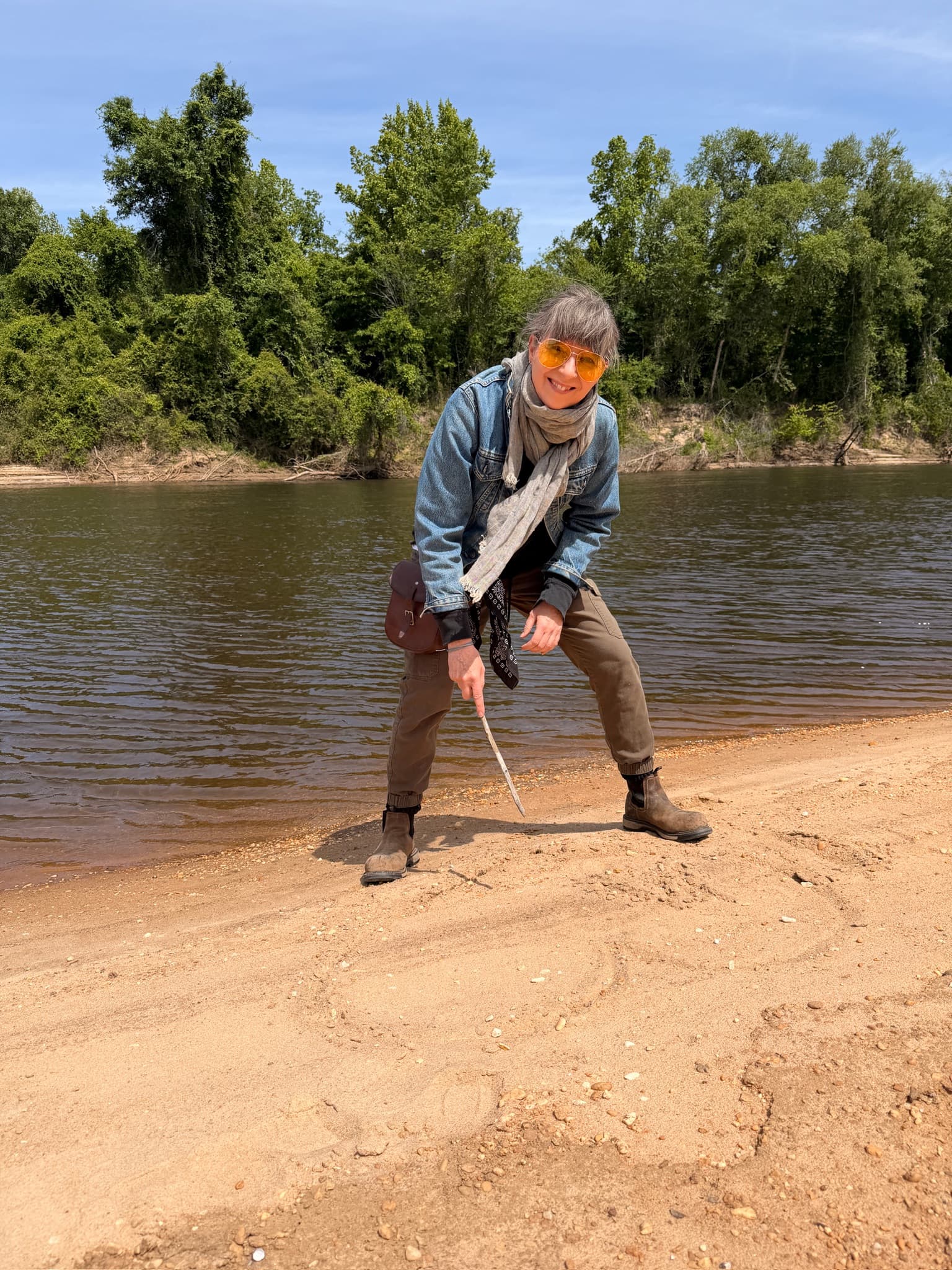 A guest enjoying the sandbar beach along the river