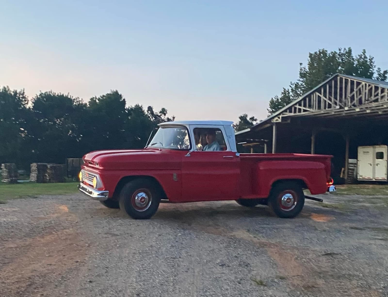 The Hayes family's classic pickup truck parked by the barn
