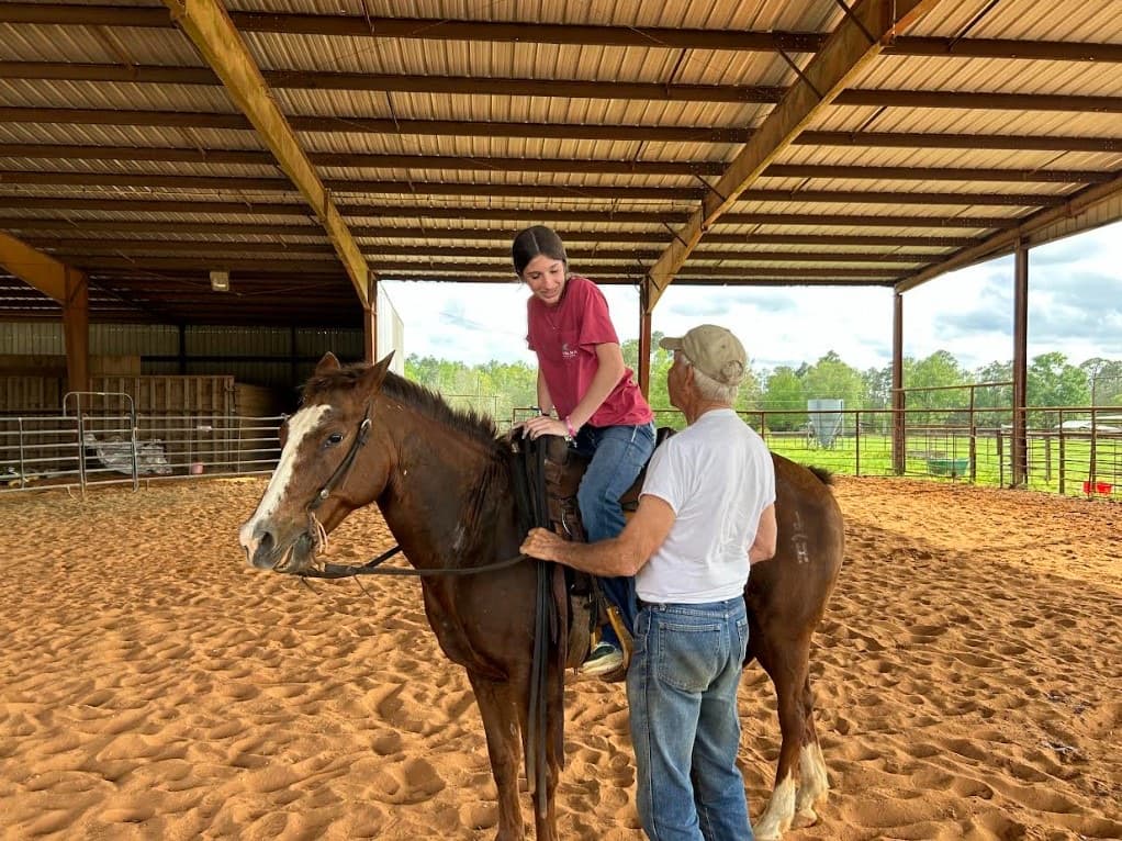 Rufus Hayes giving a riding lesson