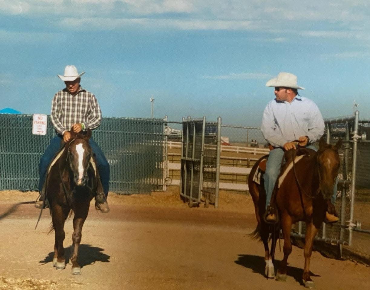 Rufus Hayes riding alongside a friend